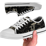 Mycelia Low Tops - sepia engraving on black featuring amanita cap, chanterelles, snail, vines, and moons