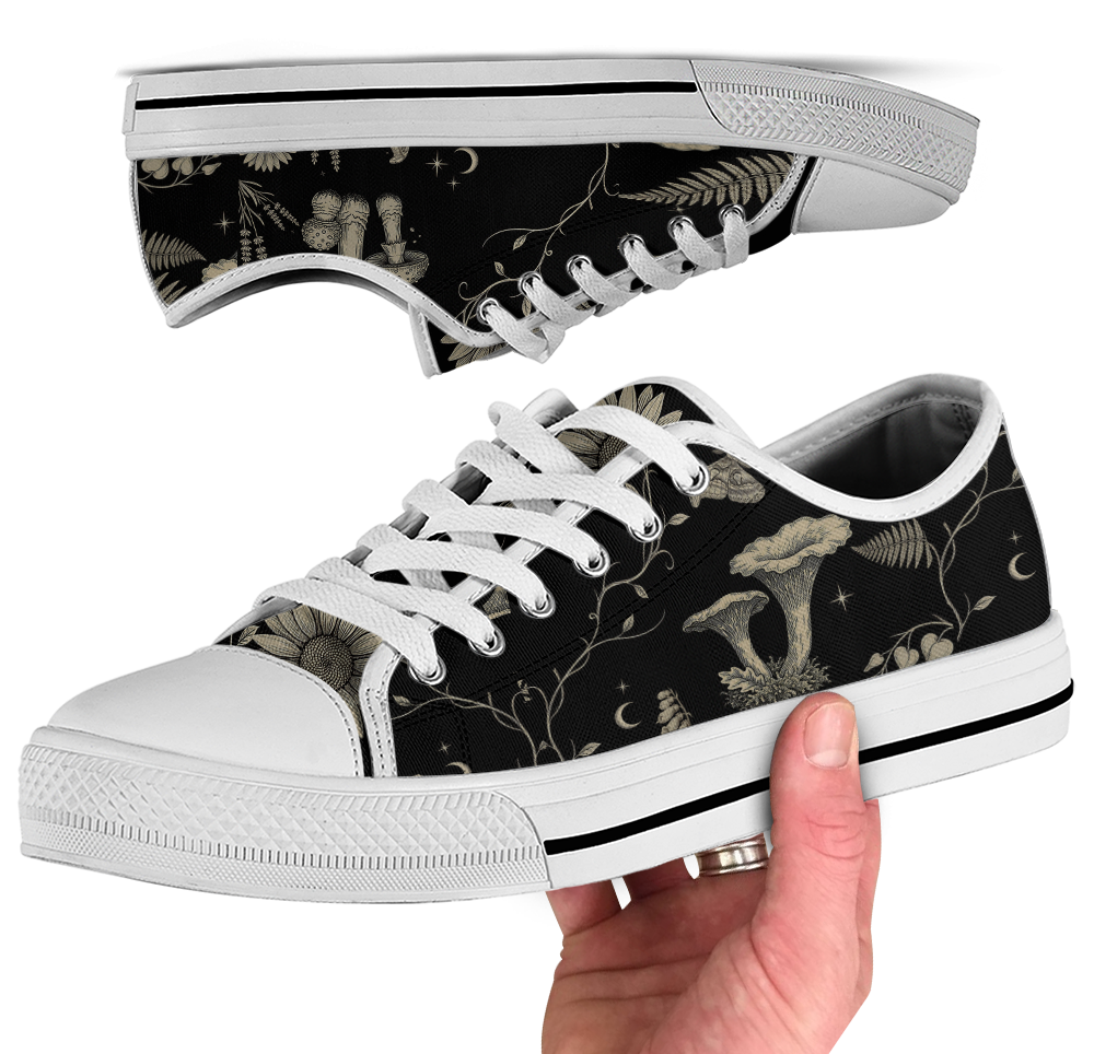 Mycelia Low Tops - sepia engraving on black featuring amanita cap, chanterelles, snail, vines, and moons
