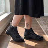 Acherontia Chelsea Boots worn with black skirt indoor lifestyle