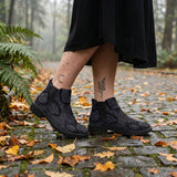 Acherontia Chelsea Boots on cobblestone autumn forest path
