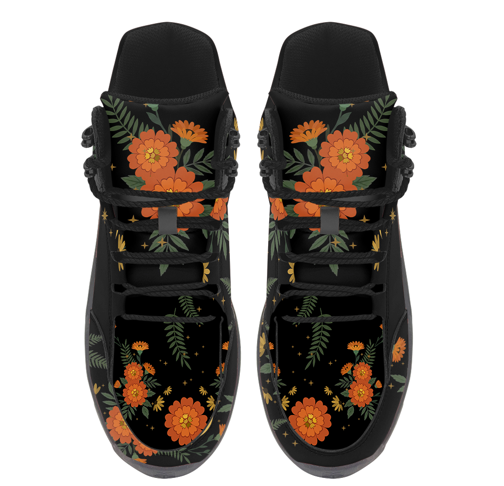 Calendula Hiking Boots — orange marigold and gold crescent moon print on black, angled pair view