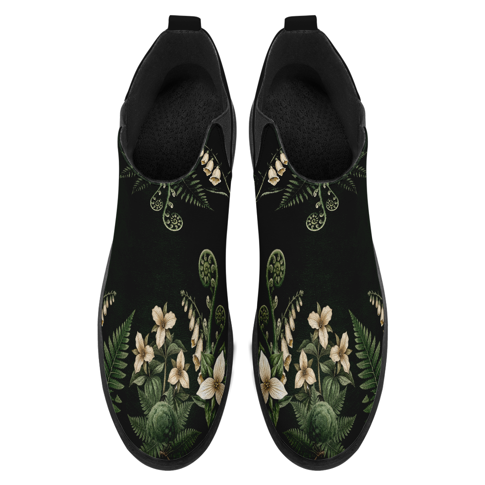 Vulpina boots top-down view — botanical print on dark forest green