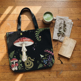 Skatheia Digitalis tote bag — flat product shot on wood floor