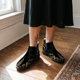 Mycelia Chelsea Boots worn with black skirt indoor lifestyle