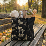 Skatheia Mycelia tote bag in autumn park — lifestyle shot
