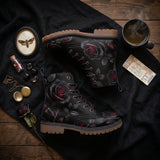 Thornveil Rose boots flat-lay black linen with moth locket and pocket watch