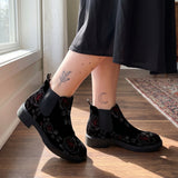 Thornveil Rose Chelsea Boots worn with black skirt indoor lifestyle